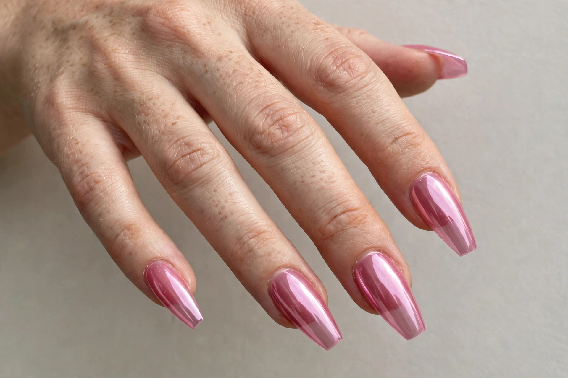 Jelly pink chrome nails on coffin nails